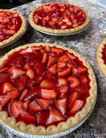 This recipe recreates the classic restaurant-style strawberry pie with a buttery homemade crust, glossy strawberry glaze, and fresh whole strawberries.